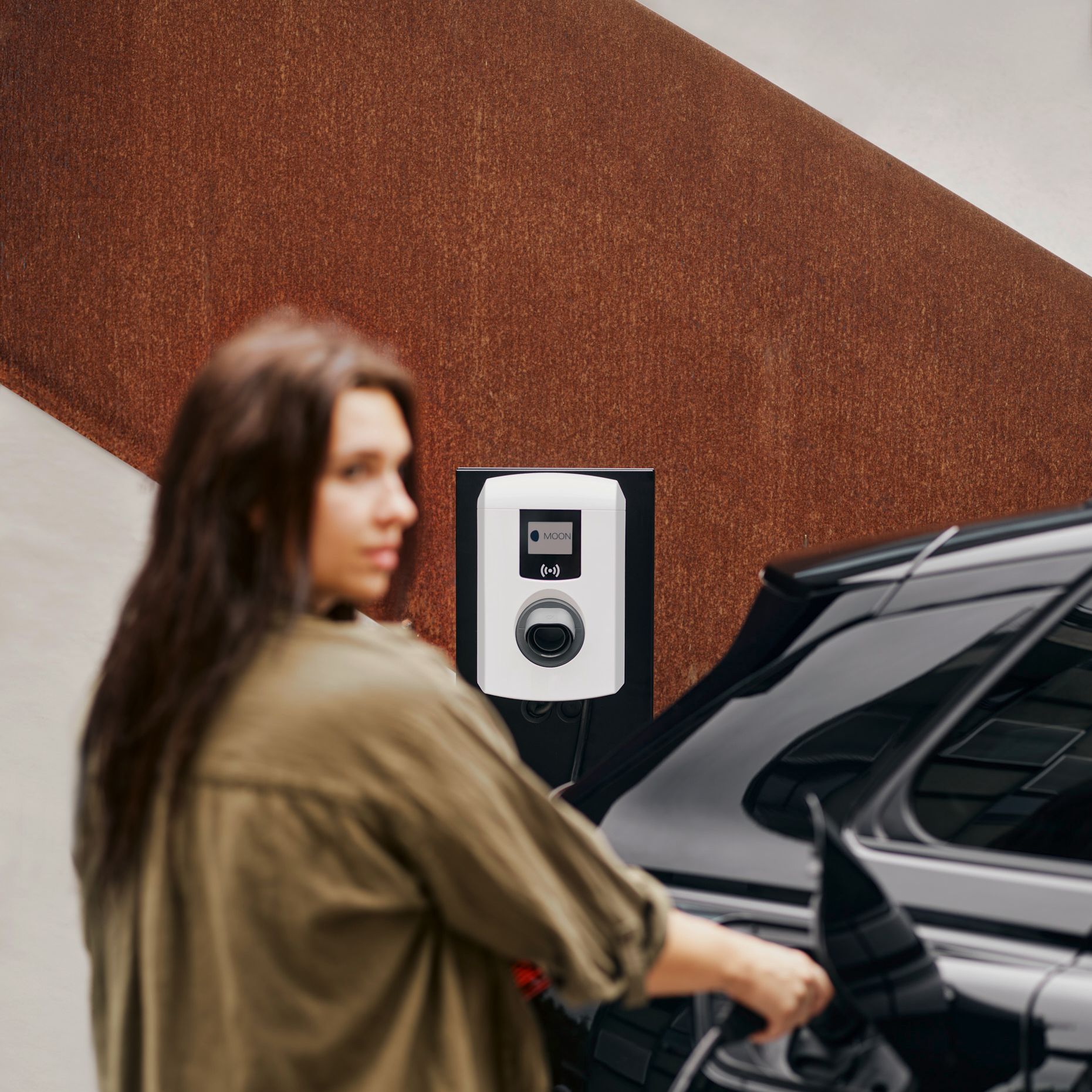 A woman puts a tap valve in a car